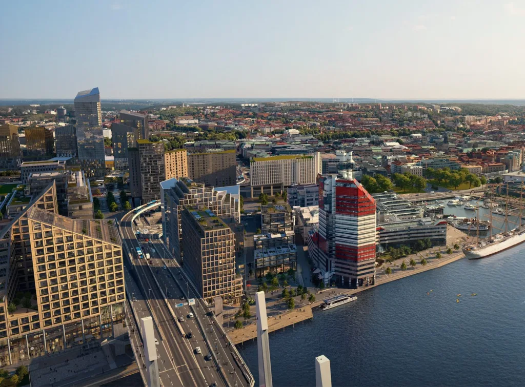 Flygvy över Göteborg med Lilla Bommen, Hisingsbron och moderna byggnader längs stadens vattenfront.