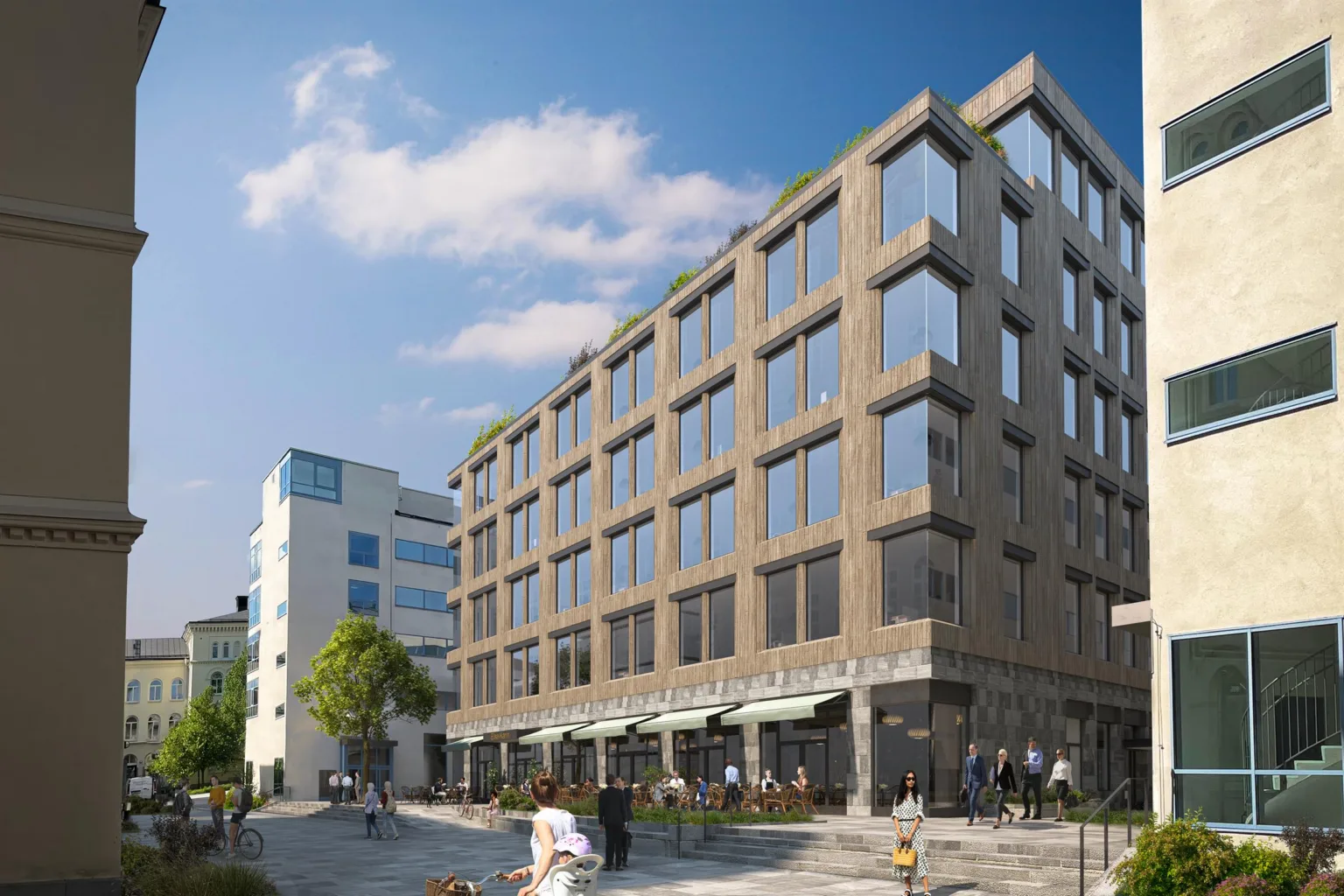 En modern byggnad med stora glasfönster under en blå himmel, omgiven av människor och grönska.