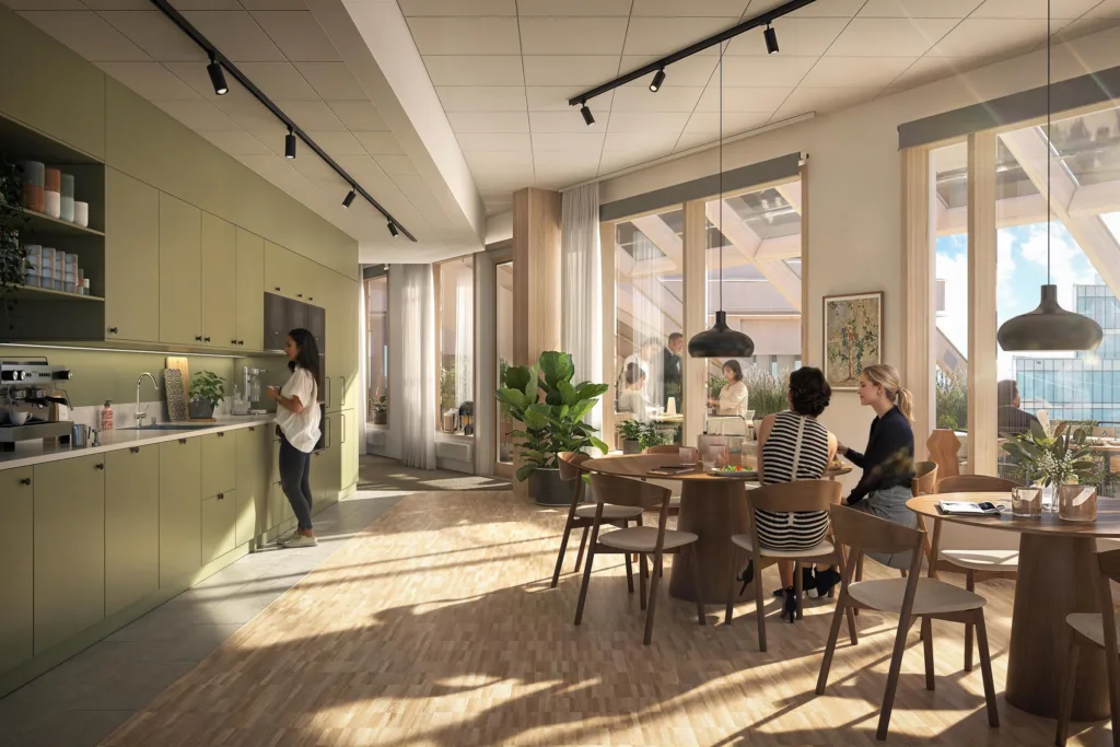 En modern interiör med stora fönster, grön vägg och personer som sitter vid ett bord eller står vid ett akvarium.